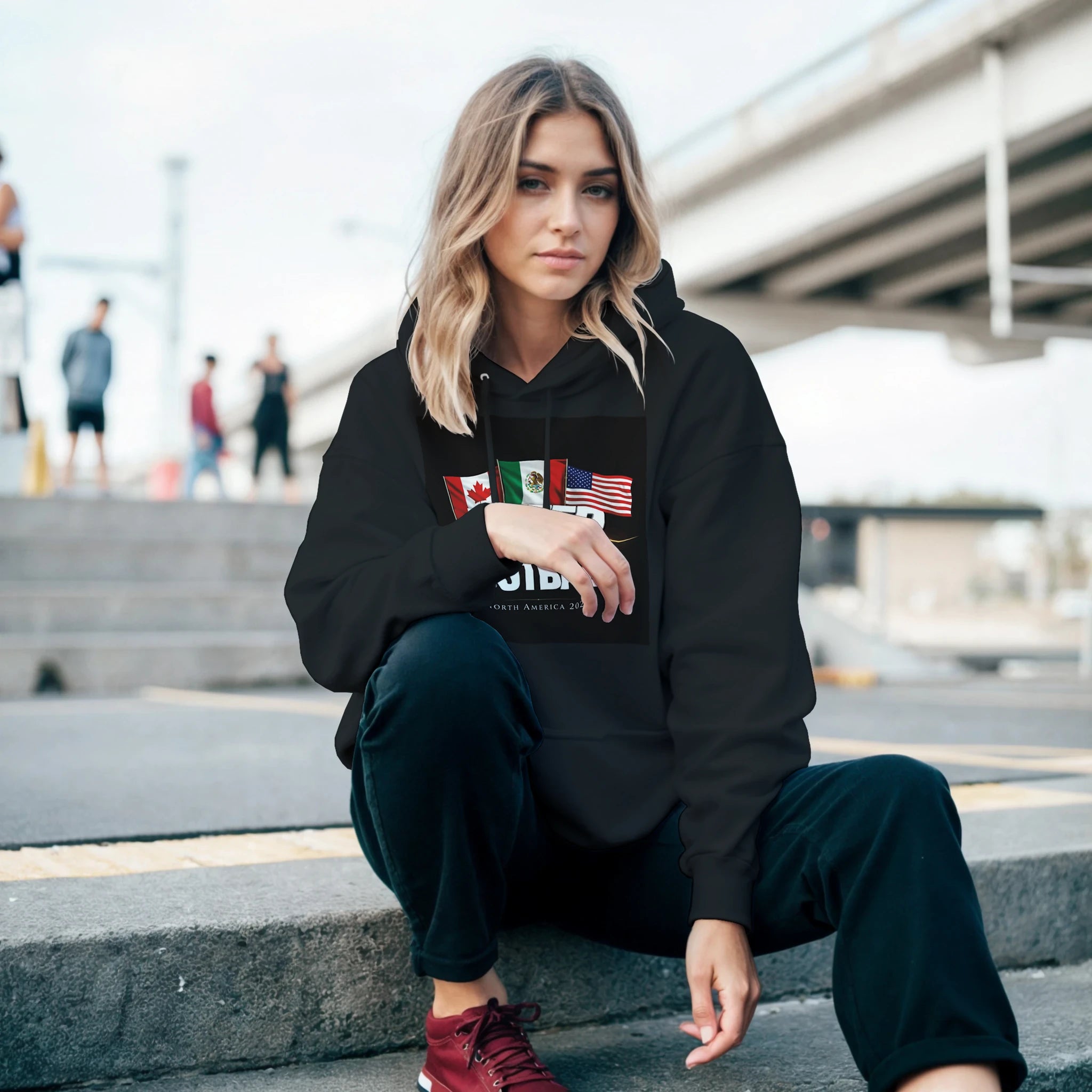 Black United by Football 2026 hoodie featuring Canada, Mexico and USA flags – North America football fan apparel